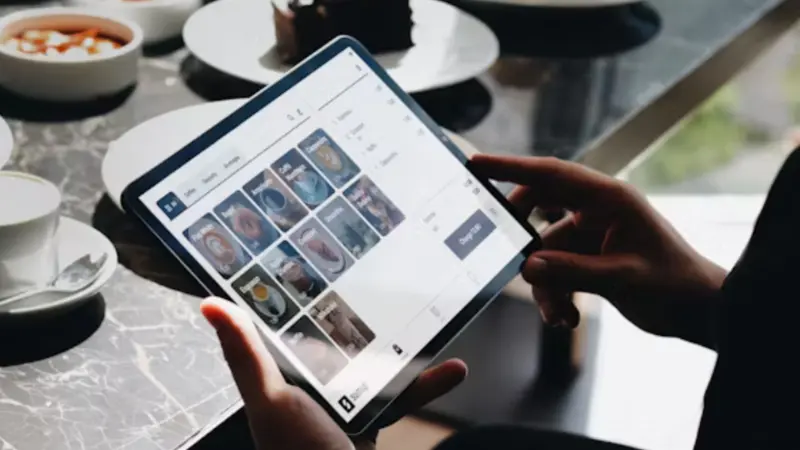 A customer using POS software to place an order
