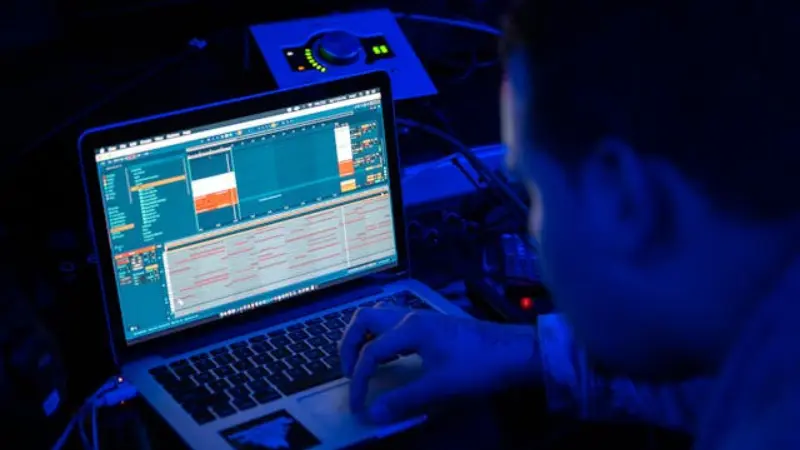 a tech guy using a laptop